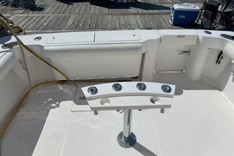  Yacht Photos Pics 2005 Luhrs 36 Convertible boat deck with rod holders and seating area.