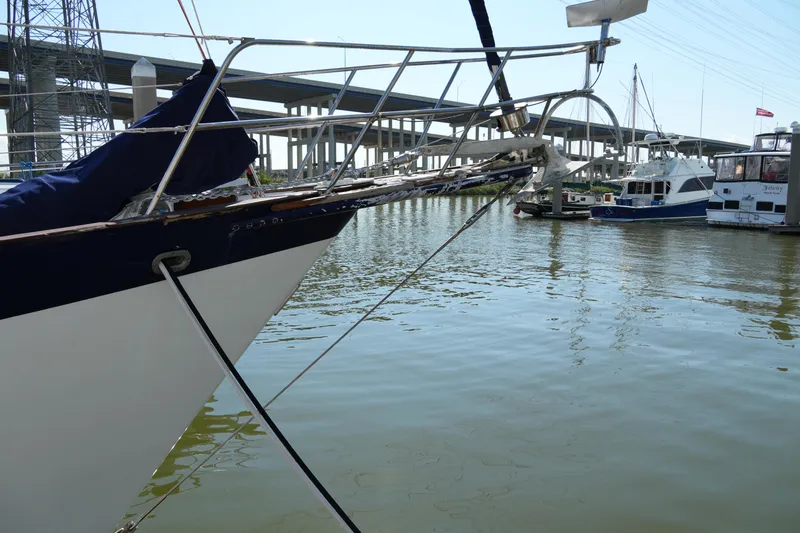 Peggy Lee Yacht Photos Pics Irwin 52 Cutter Ketch sailboat docked near a bridge, 1984 model.