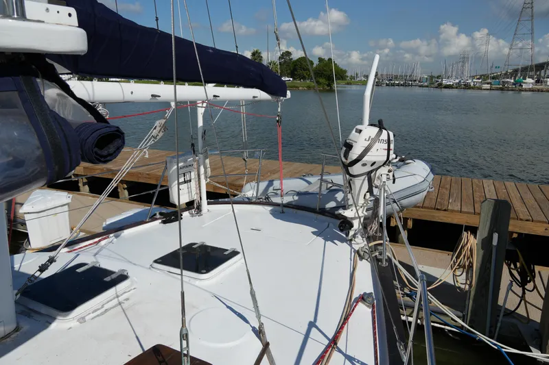 Peggy Lee Yacht Photos Pics 1984 Irwin 52 Cutter Ketch docked at marina, clear sky, calm water.