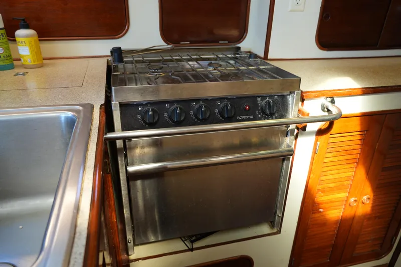 Peggy Lee Yacht Photos Pics Stainless steel stove in 1984 Irwin 52 Cutter Ketch yacht kitchen.