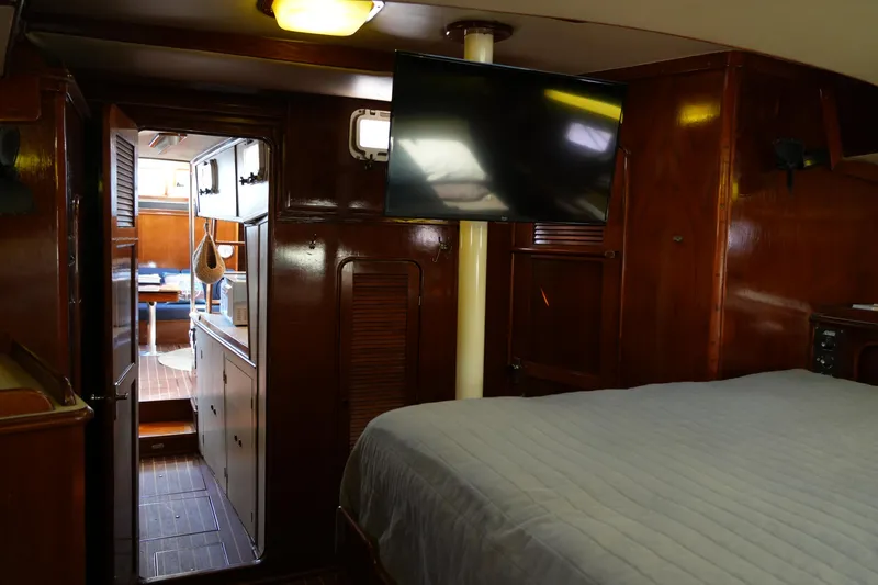 Peggy Lee Yacht Photos Pics Interior of 1984 Irwin 52 Cutter Ketch with wood paneling and modern amenities.