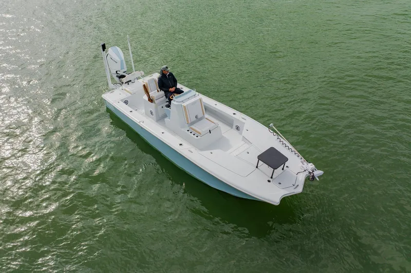  Yacht Photos Pics 2026 Broadwater 25 Bay Cat boat on calm green water, aerial view.