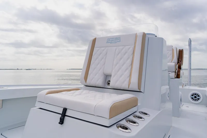  Yacht Photos Pics Luxurious seating on 2026 Broadwater 25 Bay Cat boat with ocean backdrop.