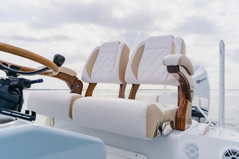  Yacht Photos Pics Luxury seating on 2026 Broadwater 25 Bay Cat boat, featuring elegant design and craftsmanship.