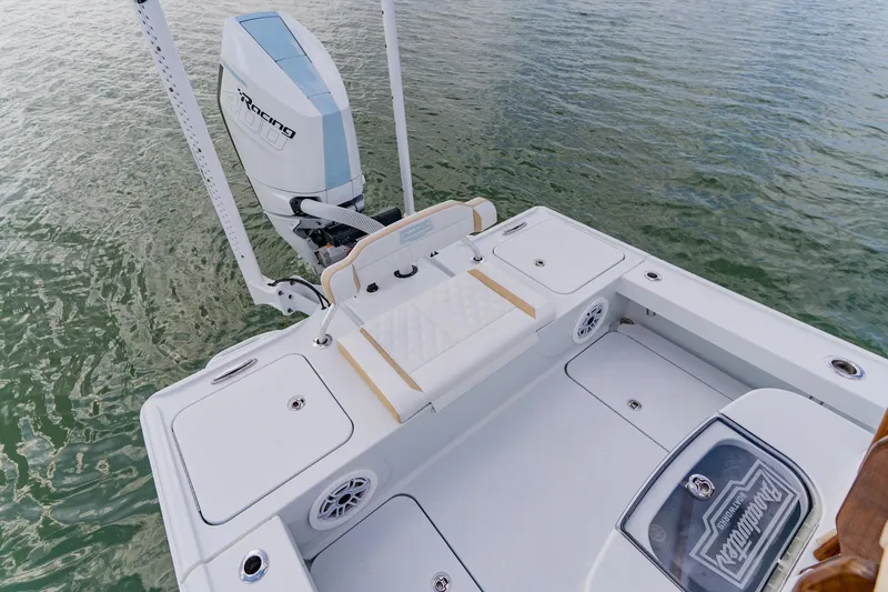  Yacht Photos Pics 2026 Broadwater 25 Bay Cat boat with powerful outboard motor on water.