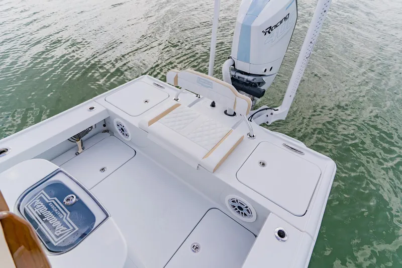  Yacht Photos Pics 2026 Broadwater 25 Bay Cat boat with sleek deck design and powerful engine on water.