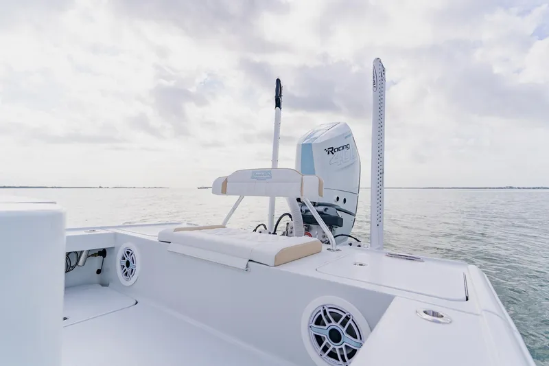  Yacht Photos Pics 2026 Broadwater 25 Bay Cat boat on calm water, featuring a powerful engine.