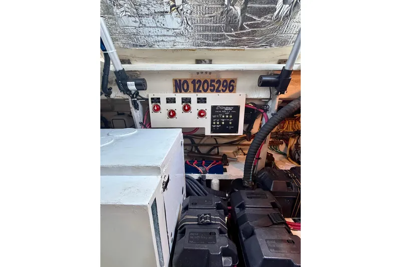  Yacht Photos Pics Engine room of 2007 Cruisers Yachts 370 Express, showing control panel and wiring.