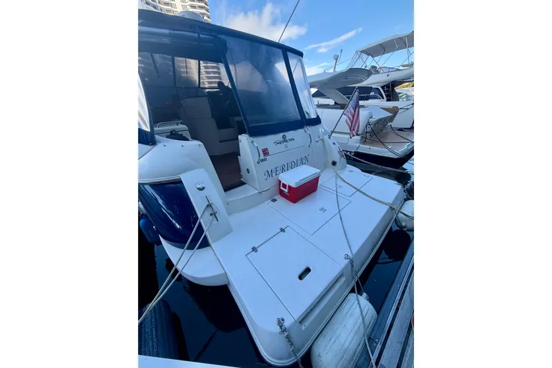  Yacht Photos Pics 2007 Cruisers Yachts 370 Express docked, featuring spacious deck and American flag.