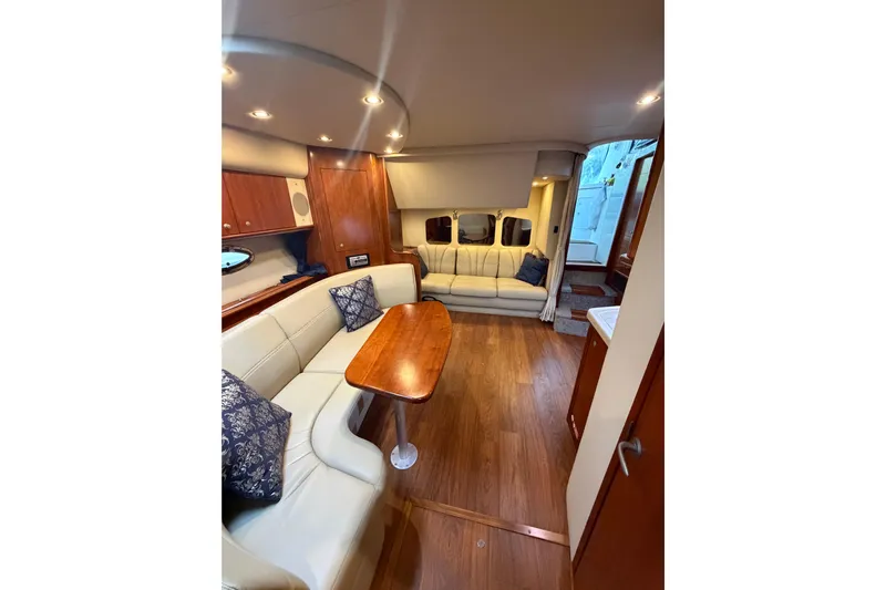  Yacht Photos Pics Luxurious interior of 2007 Cruisers Yachts 370 Express with elegant seating and wooden finishes.