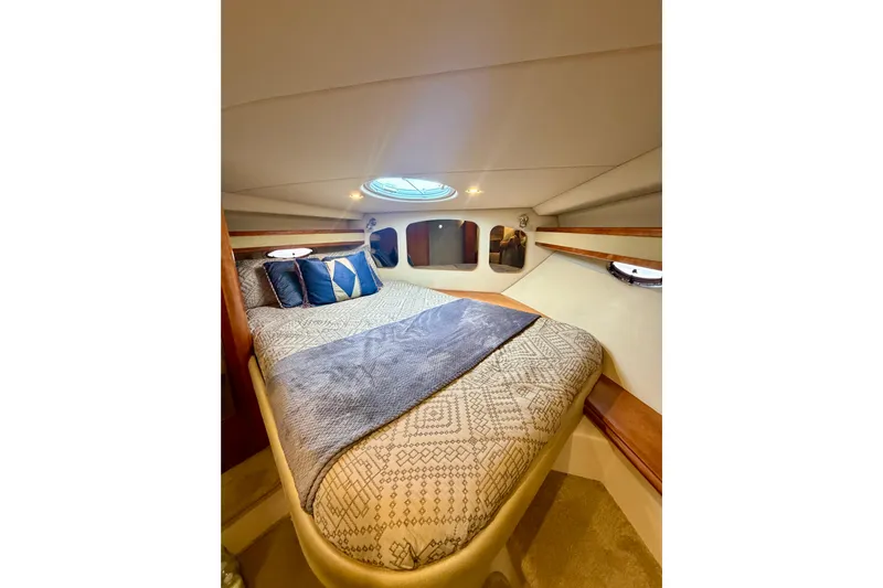 Yacht Photos Pics Luxurious cabin interior of 2007 Cruisers Yachts 370 Express with cozy bedding.