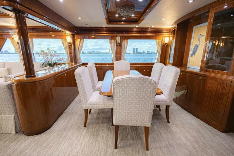 Okie Dokie Yacht Photos Pics Luxurious dining area on 2009 Hargrave Enclosed Bridge yacht with elegant wood finishes.