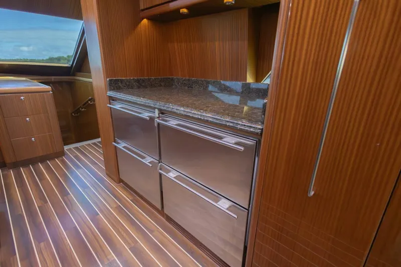 Okie Dokie Yacht Photos Pics Luxurious 2009 Hargrave Enclosed Bridge yacht interior with wood paneling and modern cabinetry.