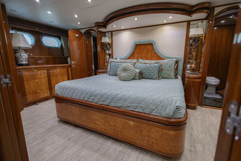 Okie Dokie Yacht Photos Pics Luxurious bedroom interior of 2009 Hargrave Enclosed Bridge yacht with elegant wood finishes.