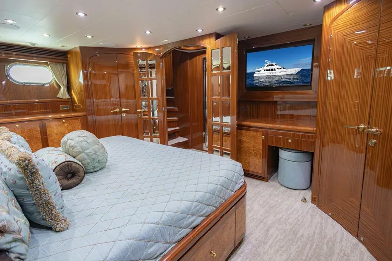 Okie Dokie Yacht Photos Pics Luxurious 2009 Hargrave Enclosed Bridge yacht bedroom with elegant wood finishes and plush bedding.