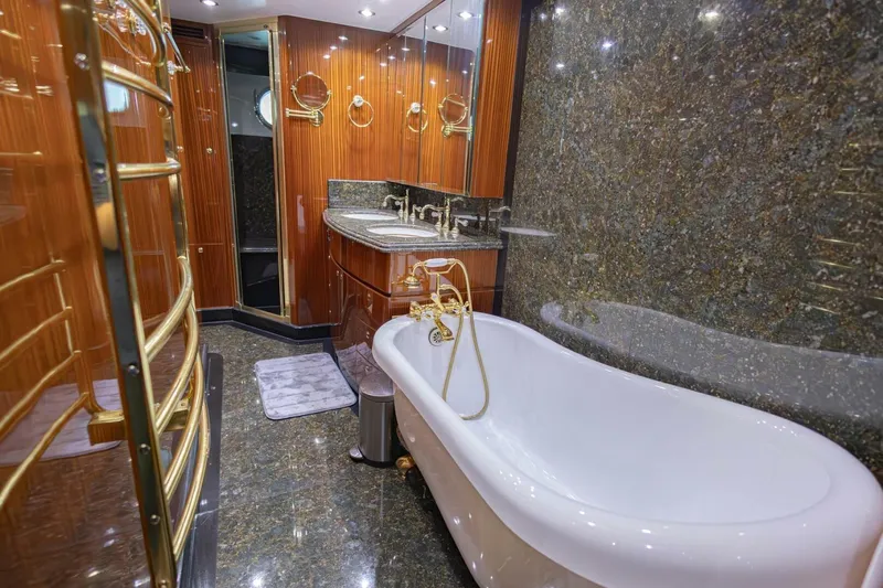 Okie Dokie Yacht Photos Pics Luxurious yacht bathroom with elegant bathtub, marble surfaces, and wooden accents, Hargrave Enclosed Bridge 2009.