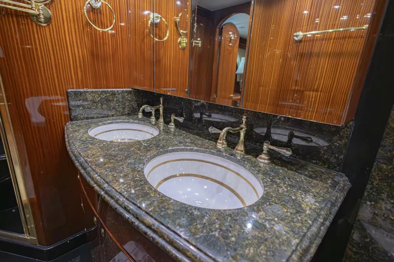 Okie Dokie Yacht Photos Pics Luxurious bathroom with dual sinks and marble countertop in 2009 Hargrave Enclosed Bridge yacht.
