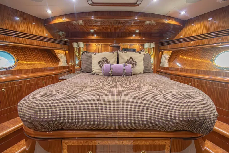 Okie Dokie Yacht Photos Pics Luxurious 2009 Hargrave Enclosed Bridge yacht bedroom with elegant wood paneling and plush bedding.