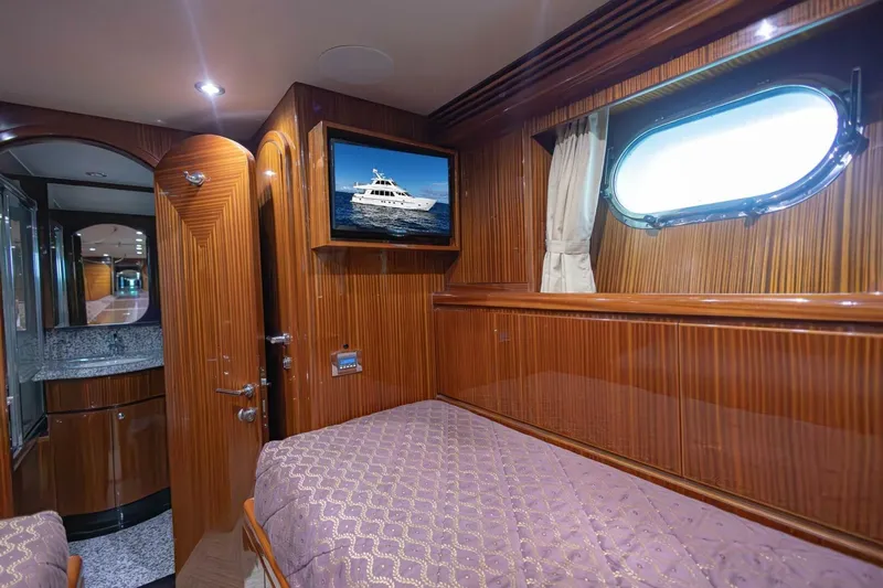 Okie Dokie Yacht Photos Pics Luxurious 2009 Hargrave Enclosed Bridge yacht cabin with wood paneling and porthole window.