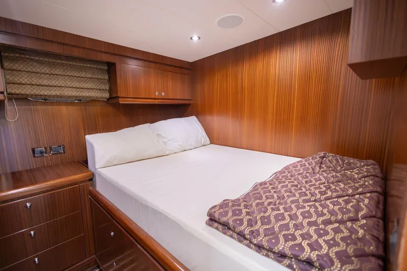 Okie Dokie Yacht Photos Pics Luxurious cabin interior of 2009 Hargrave Enclosed Bridge yacht with wood paneling.