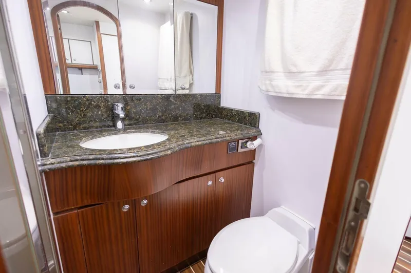 Okie Dokie Yacht Photos Pics Luxurious bathroom in 2009 Hargrave Enclosed Bridge yacht with elegant wood cabinetry.