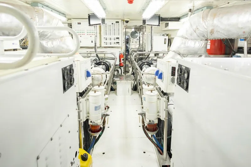 Okie Dokie Yacht Photos Pics Engine room of 2009 Hargrave Enclosed Bridge yacht, featuring machinery and control panels.