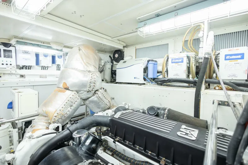 Okie Dokie Yacht Photos Pics Engine room of 2009 Hargrave Enclosed Bridge yacht, featuring CAT machinery and equipment.