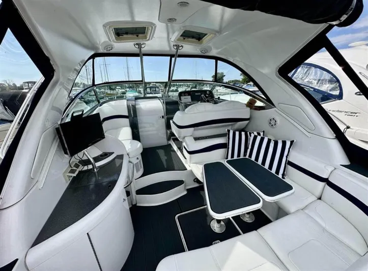  Yacht Photos Pics Interior of 2013 Formula 37 PC yacht with modern seating and striped cushions.