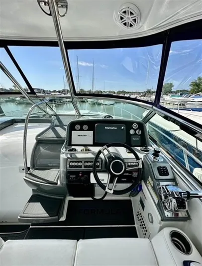  Yacht Photos Pics Cockpit of 2013 Formula 37 PC yacht with modern navigation equipment and steering wheel.