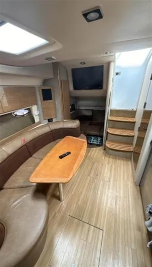  Yacht Photos Pics Interior of 2013 Formula 37 PC yacht with seating, table, and stairs.