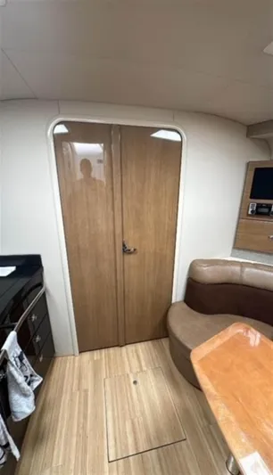  Yacht Photos Pics Interior of 2013 Formula 37 PC yacht with wood finish and seating area.