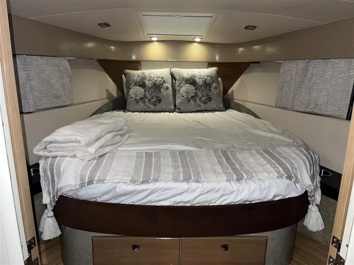  Yacht Photos Pics Cozy bedroom in 2013 Formula 37 PC yacht with elegant bedding and soft lighting.