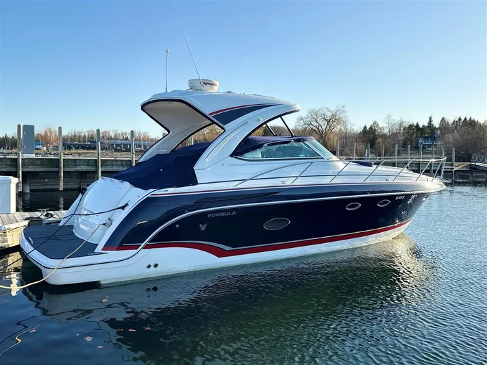  Yacht Photos Pics 2013 Formula 37 PC yacht docked in a marina, featuring sleek design and blue hull.