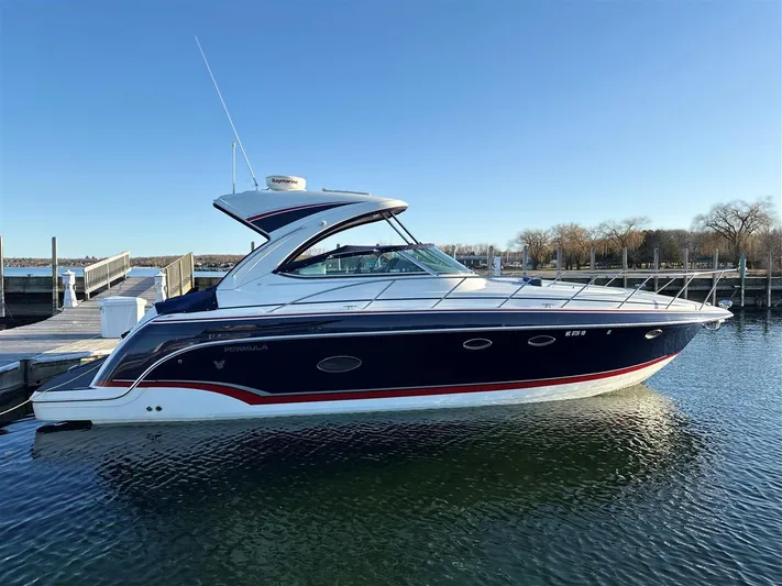  Yacht Photos Pics 2013 Formula 37 PC yacht docked in calm waters under clear blue sky.