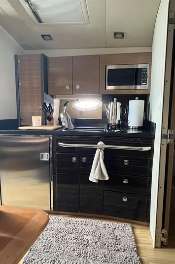  Yacht Photos Pics Modern kitchen in a 2013 Formula 37 PC yacht with stainless steel appliances.