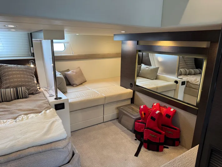  Yacht Photos Pics Luxurious 2017 Cruisers Yachts 45 Cantius cabin interior with cozy seating and life jackets.