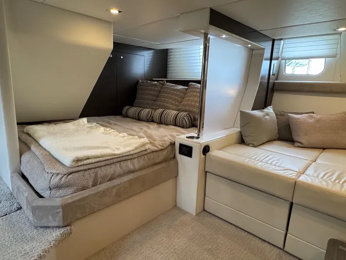  Yacht Photos Pics Luxurious interior of 2017 Cruisers Yachts 45 Cantius with cozy bed and seating area.