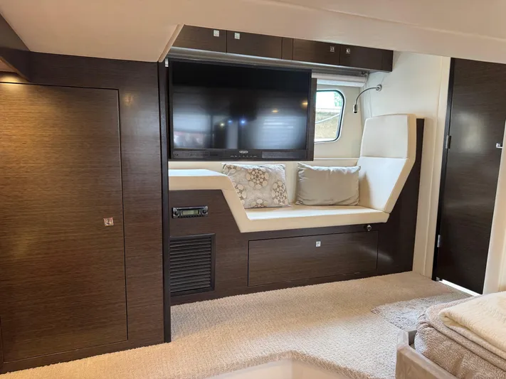  Yacht Photos Pics Luxurious interior of 2017 Cruisers Yachts 45 Cantius with TV and seating area.