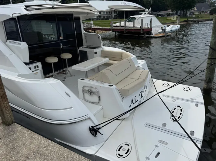  Yacht Photos Pics 2017 Cruisers Yachts 45 Cantius docked, featuring spacious seating and modern design.