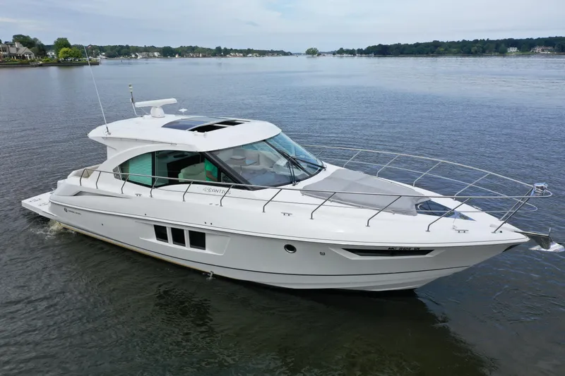  Yacht Photos Pics 2017 Cruisers Yachts 45 Cantius luxury boat on calm water, side view.