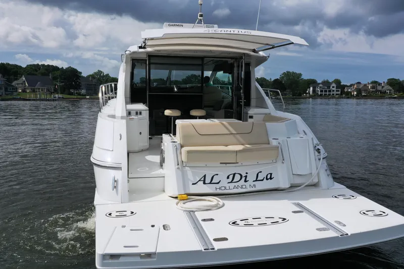  Yacht Photos Pics 2017 Cruisers Yachts 45 Cantius on water, rear view, with "AL Di La" name visible.