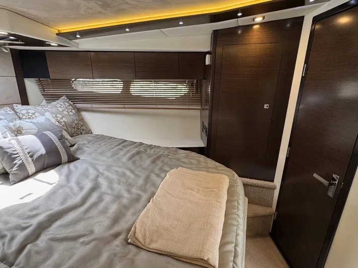  Yacht Photos Pics Luxurious bedroom interior of 2017 Cruisers Yachts 45 Cantius with modern design and cozy bedding.