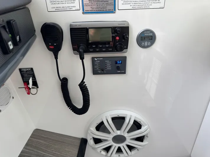  Yacht Photos Pics Control panel of 2017 Cruisers Yachts 45 Cantius with radio, speaker, and gauges.