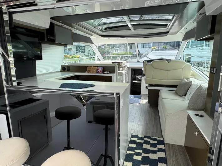  Yacht Photos Pics Luxurious interior of 2017 Cruisers Yachts 45 Cantius with modern seating and sleek design.