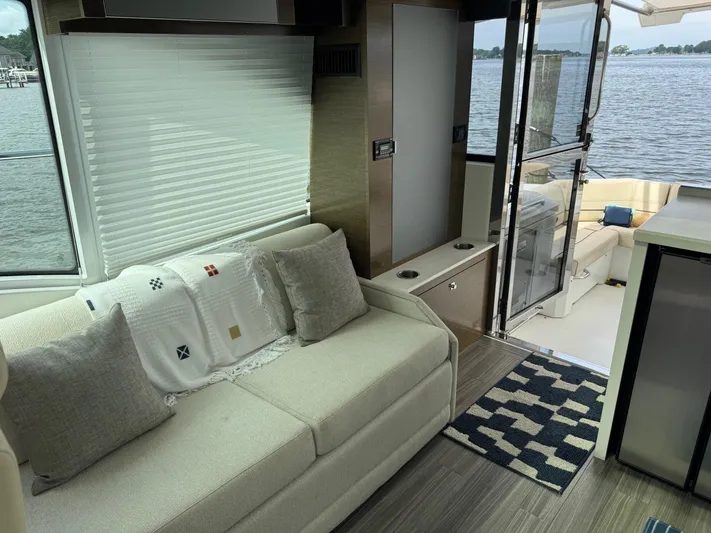  Yacht Photos Pics Interior of 2017 Cruisers Yachts 45 Cantius with cozy seating and lake view.