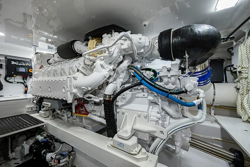 Big Stink Yacht Photos Pics Engine room of 2026 Viking 54 Convertible yacht, showcasing advanced machinery and components.