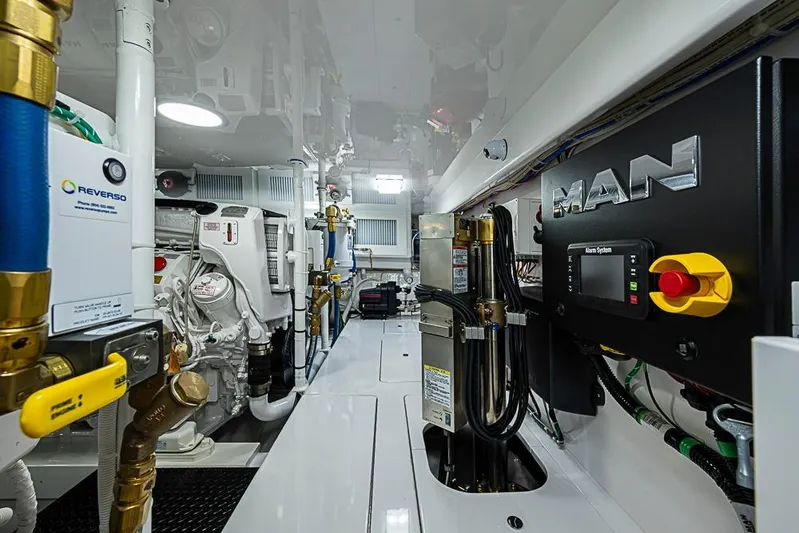 Big Stink Yacht Photos Pics Engine room of 2026 Viking 54 Convertible yacht, featuring MAN systems and Reverso components.