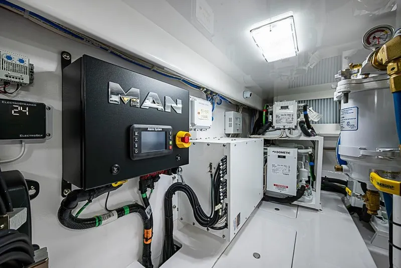Big Stink Yacht Photos Pics Engine room of 2026 Viking 54 Convertible yacht with MAN control system.