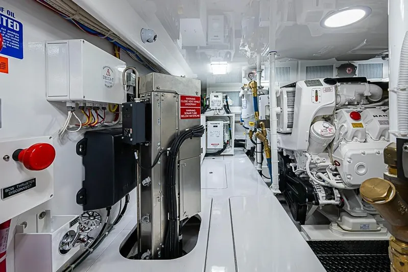 Big Stink Yacht Photos Pics Engine room of 2026 Viking 54 Convertible yacht, showcasing advanced machinery and equipment.