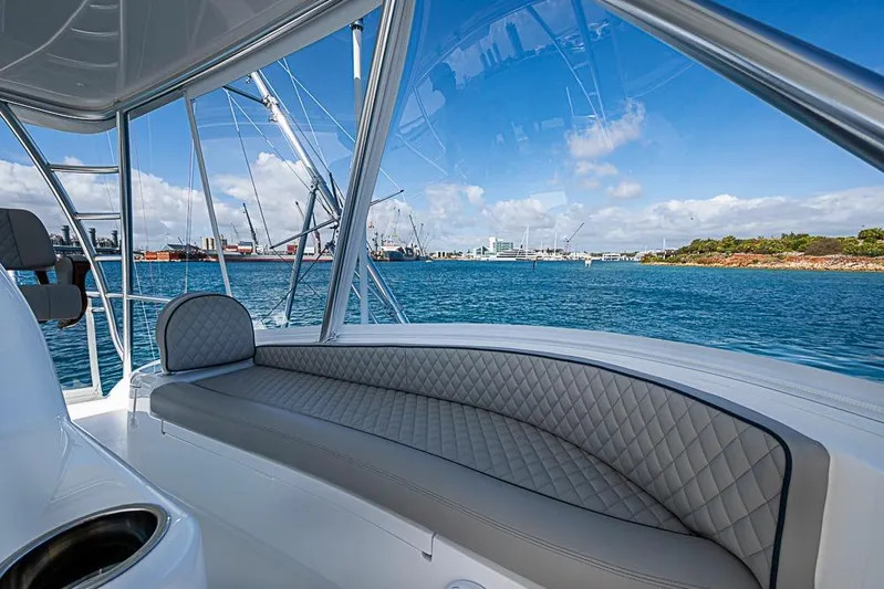 Big Stink Yacht Photos Pics 2026 Viking 54 Convertible yacht interior with ocean view and luxurious seating.